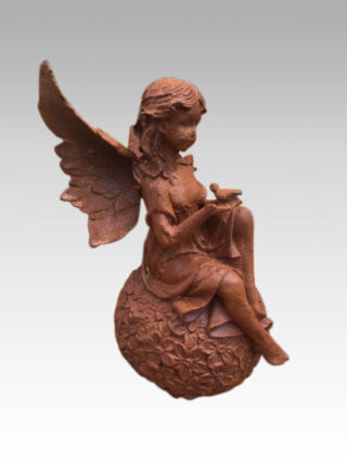 cast iron angel wings on globe - eliassen.nl