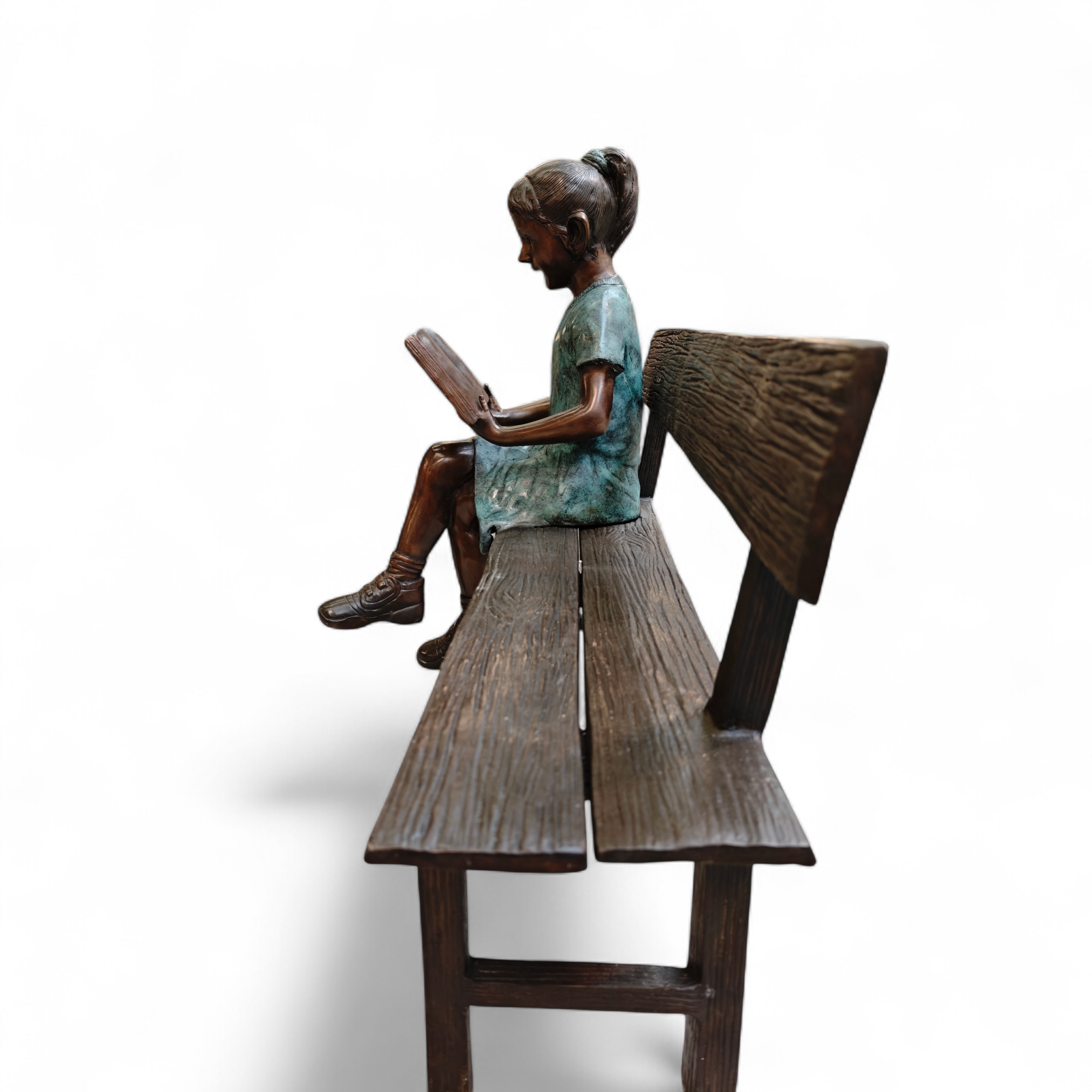 Reading girl on bench bronze 111cm